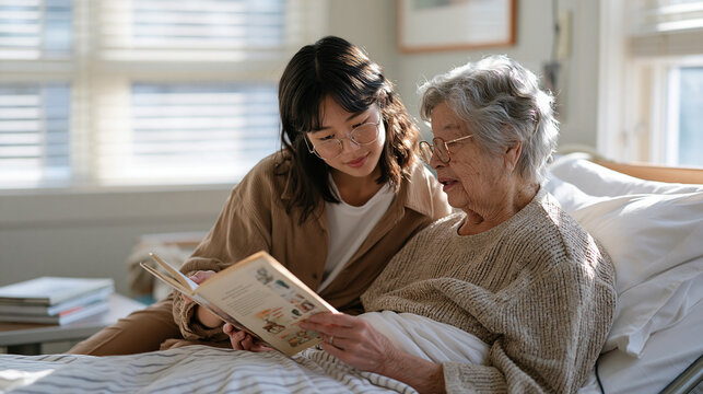 Teenage volunteer reads aloud from a paperback to a bedridden elderly woman in a skilled nursing facility room, both figures sharing a quiet intergenerational connection,