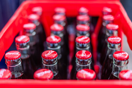 Altea, Spain - August 05, 2026 - Coca-Cola Bottles in Red Crate, Top View Close Up with Shallow Depth of Field and Copy Space
