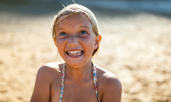 Portrait of girl making face on the beach