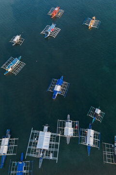 Aerial view of outrigger boats floating on the sea in Coron Palawan