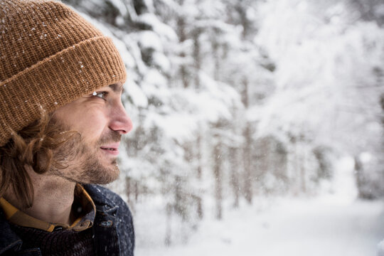 Portrait of man in winter forest