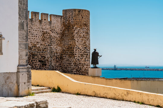 Historic castle and statue overlooking the sea in Sines Portugal