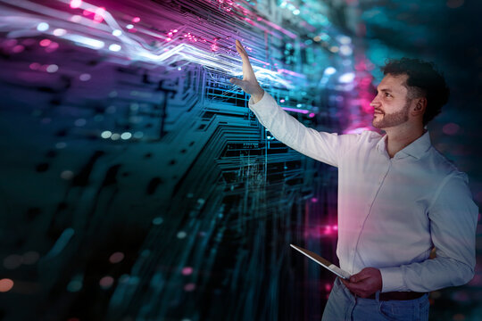 Businessman touches futuristic digital screen in the office