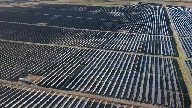 Aerial View of Vast Solar Farm Generating Clean Renewable Energy