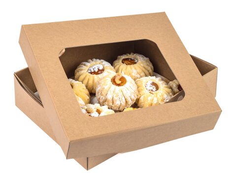  gift box of butter swirl cookies topped with chocolate and nuts isolated on white background
