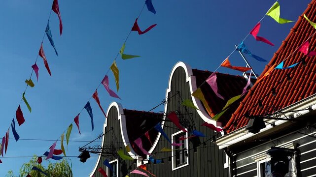 Colorful bunting above traditional architecture in Volendam, Netherlands