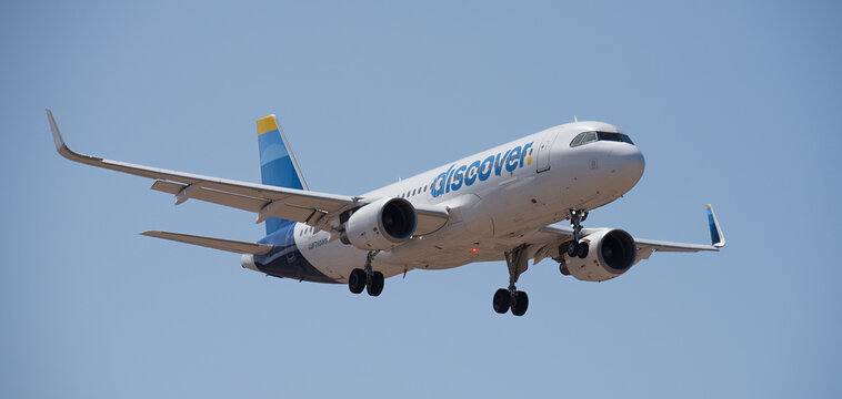 Tenerife, Spain September 6st, 2026. Airbus A320-214 Discover Airlines flies in the blue sky. Landing at Tenerife Airport