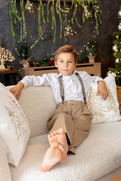Happy child on Christmas, enjoying some quality time, opening presents, kids on Christmas eve in decorated home