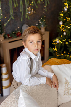 Happy child on Christmas, enjoying some quality time, opening presents, kids on Christmas eve in decorated home