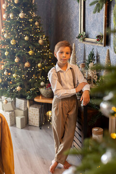 Happy child on Christmas, enjoying some quality time, opening presents, kids on Christmas eve in decorated home