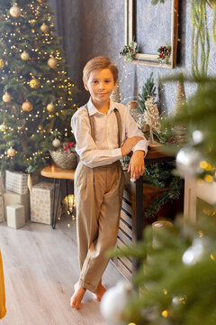 Happy child on Christmas, enjoying some quality time, opening presents, kids on Christmas eve in decorated home