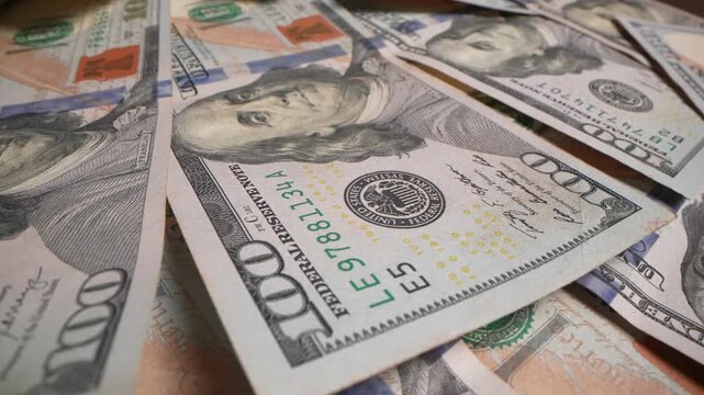 Large amount of 100 US dollar bills lying together. Financial concept of banking, investment, cash flow and big money earnings in business