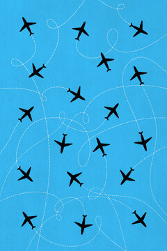 Illustration of airplane silhouettes with flight paths on blue
