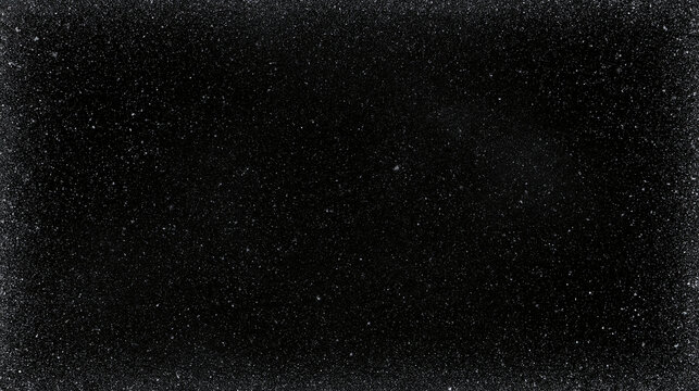 Dark abstract background with fine white dust texture. Winter frost and snow frame. Grunge noise overlay. Vintage film grain effect or a textured backdrop.