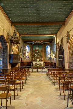 Empty church nave viewed from the entrance toward the altar, Gers, Saint Georges, France