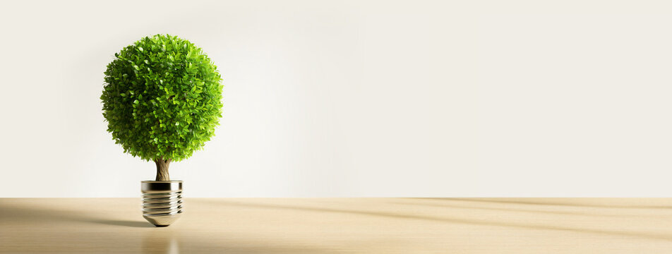 Green tree light bulb for eco energy sustainability and esg concept with copy space