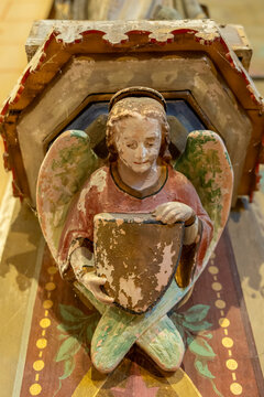 Carved wooden angel holding a blank heraldic shield, Gers, Saint Georges, France