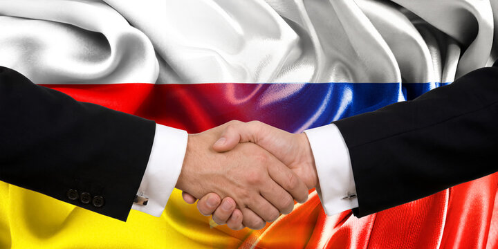 Handshake between Russia and South Ossetia, international friendship, background with flags. Flags.