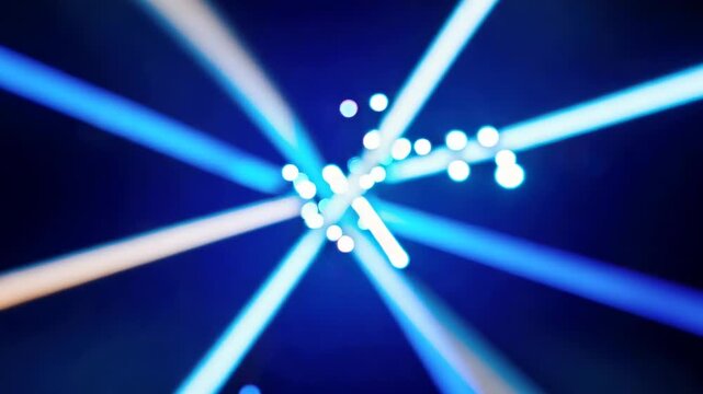 Dynamic blue and white laser beams intersect and radiate outward, creating a vibrant light display against a dark background in a visually striking arrangement