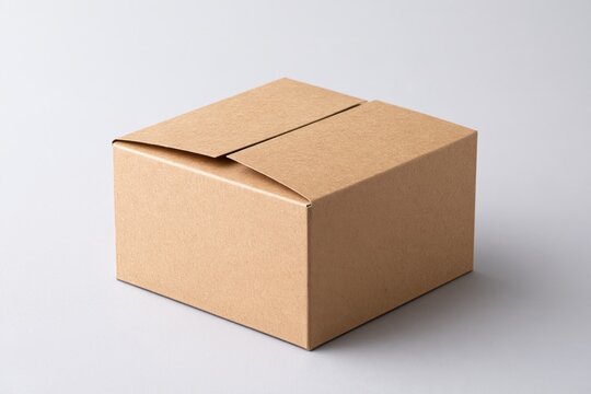 Closed cardboard box isolated on light background, plain shipping package for ecommerce delivery, logistics, online shopping, storage and product packaging