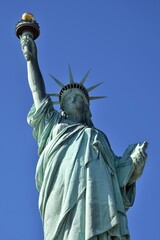 Statue of Liberty under clear blue sky on Liberty Island in New York City USA © rbkgm146