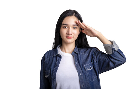 Asian woman saluting in denim shirt isolated on white background with clipping path