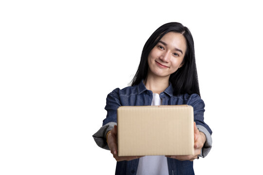 Smiling Asian woman holding cardboard box isolated on white background with clipping path for delivery and shopping concept
