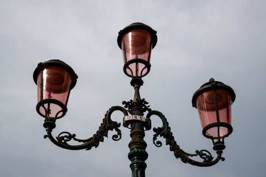 Vintage triple-headed street lamp in Venice, Italy