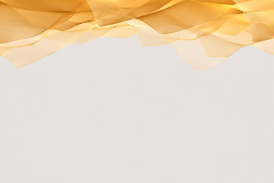 Soft golden topaz layers hang from the upper border of a pale gray background with spacious copy space. generated by AI.