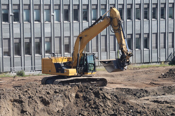 Excavator under processen, urban modernisation, machines building  © onechance