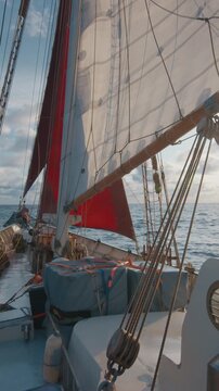 Big expeditional sailing boat sails in the ocean under the sails