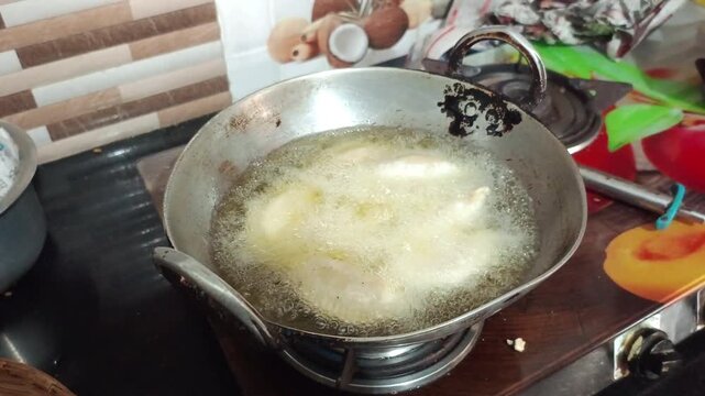 Deep Frying Gujiya Sweets in Oil in Metal Wok Close Up