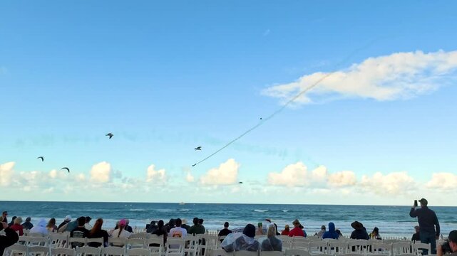 Aviation Display with Smoke Trails over Beach Audience in Surfers Paradise