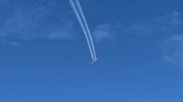 Stunt Plane Performing Aerobatics with Smoke Trails at Gold Coast Pacific Airshow