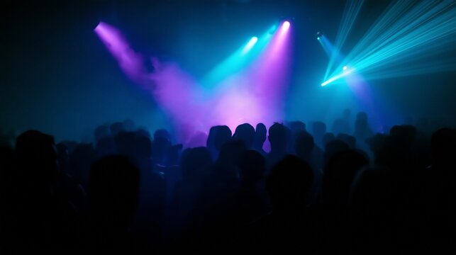 Crowd enjoying music and lights at a nightlife event in a club setting