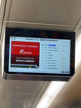 24 April 2026, Italy, Milano Central Station to Genova Brignole - Trenitalia display showing all stops in Lambrate Rogoredo Pavia