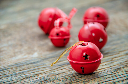 Christmas Jingle bells on a rustic wooden background