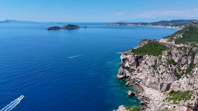 Aerial view of Porto Timoni beach with turquoise waters and rocky cliffs along the coastline in Kerkira, Greece.
