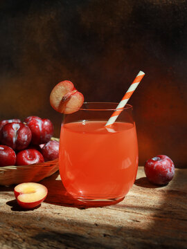 Fresh cherry plum juice in glass, refreshment drinks.