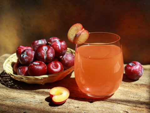 Fresh cherry plum juice in glass, refreshment drinks.