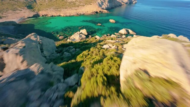 Dynamic FPV Drone Dive Down a Rocky Coastal CliffDynamic FPV Drone Dive Down a Rocky Coastal Cliff