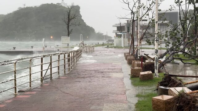Waves And Sea Spray Drench Urban Waterfront During Hurricane