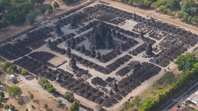 Aerial view of Sewu Temple complex with its central sanctuary surrounded by rows of smaller shrines and stone structures in Kecamatan Prambanan, Daerah Istimewa Yogya, Indonesia.