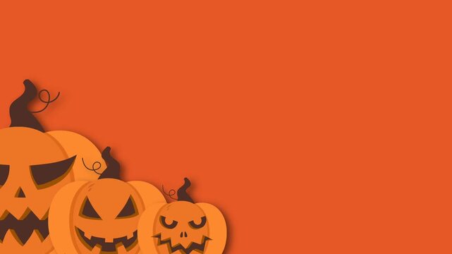 Spooky Halloween background with carved jack o lantern pumpkins on vibrant orange surface with copy space.