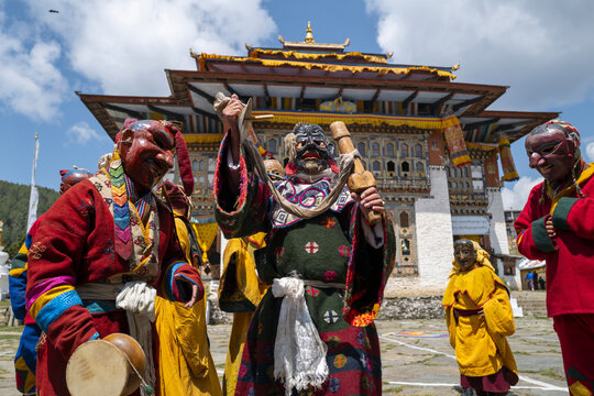 Group of masked cham dancers performing a ritual dance, Thimphu District, Thimphu, Bhutan