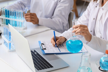Scientific research and medical innovation, scientists working in laboratory with chemical test...