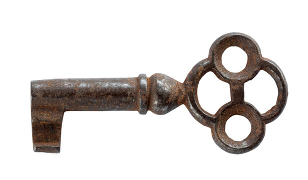 Antique old iron barn key with a rustic aged surface, isolated on a white background. Traditional locking hardware from an old farm or rural building
