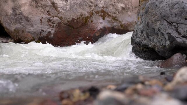 Waterfall in summer. Many small streams flow from the lava field. A river with the purest glacial water of turquoise blue color. Pure nature, drinking water. Epic landscape aerial view 4k. Iceland.