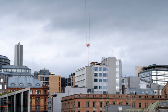 Overcast skyline of Oslo Norway shows a layered urban panorama with varied buildings towers and rooftops beneath a grey northern sky
