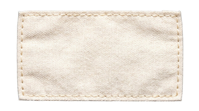 Blank fabric clothing label with stitched edges in studio lighting on a transparent background